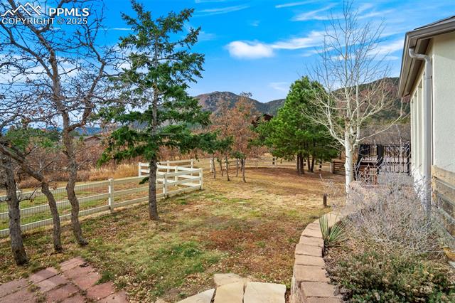4385 Sandstone Road Monument, CO 80132 - Photo 47 of 50 View of yard with a mountain view and a view of rural / pastoral area