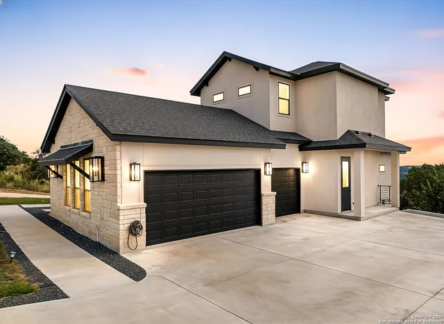 a front view of a house with a garage