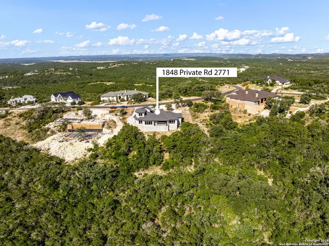 front view of a house with a tree