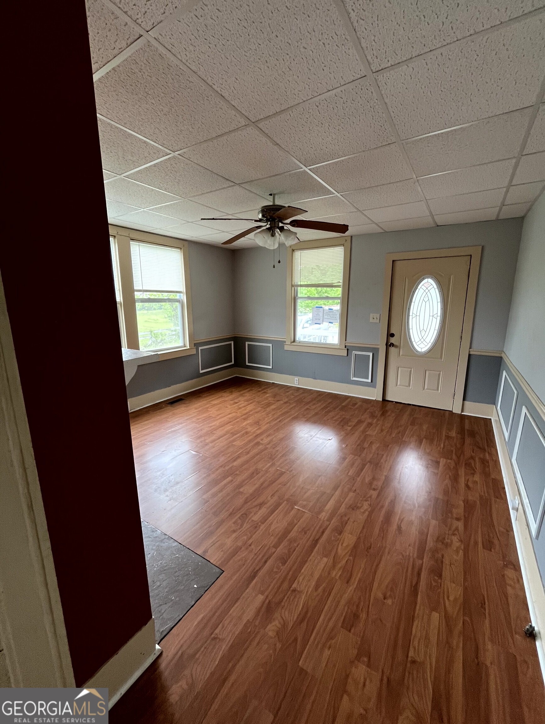 430 Knight Street Elberton, GA 30635 - Photo 12 of 15 an empty room with wooden floor and windows