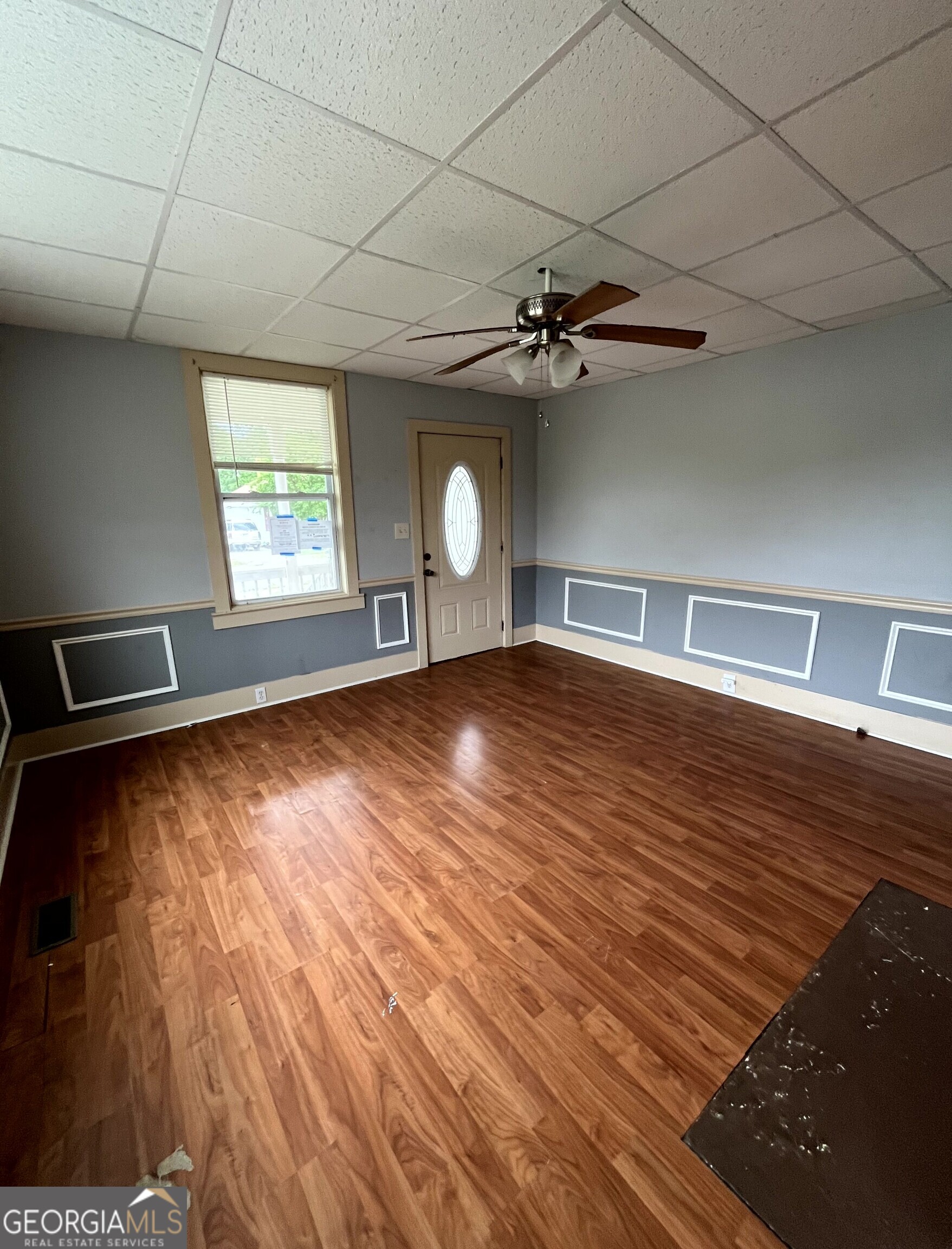 430 Knight Street Elberton, GA 30635 - Photo 13 of 15 a view of an empty room with window and wooden floor