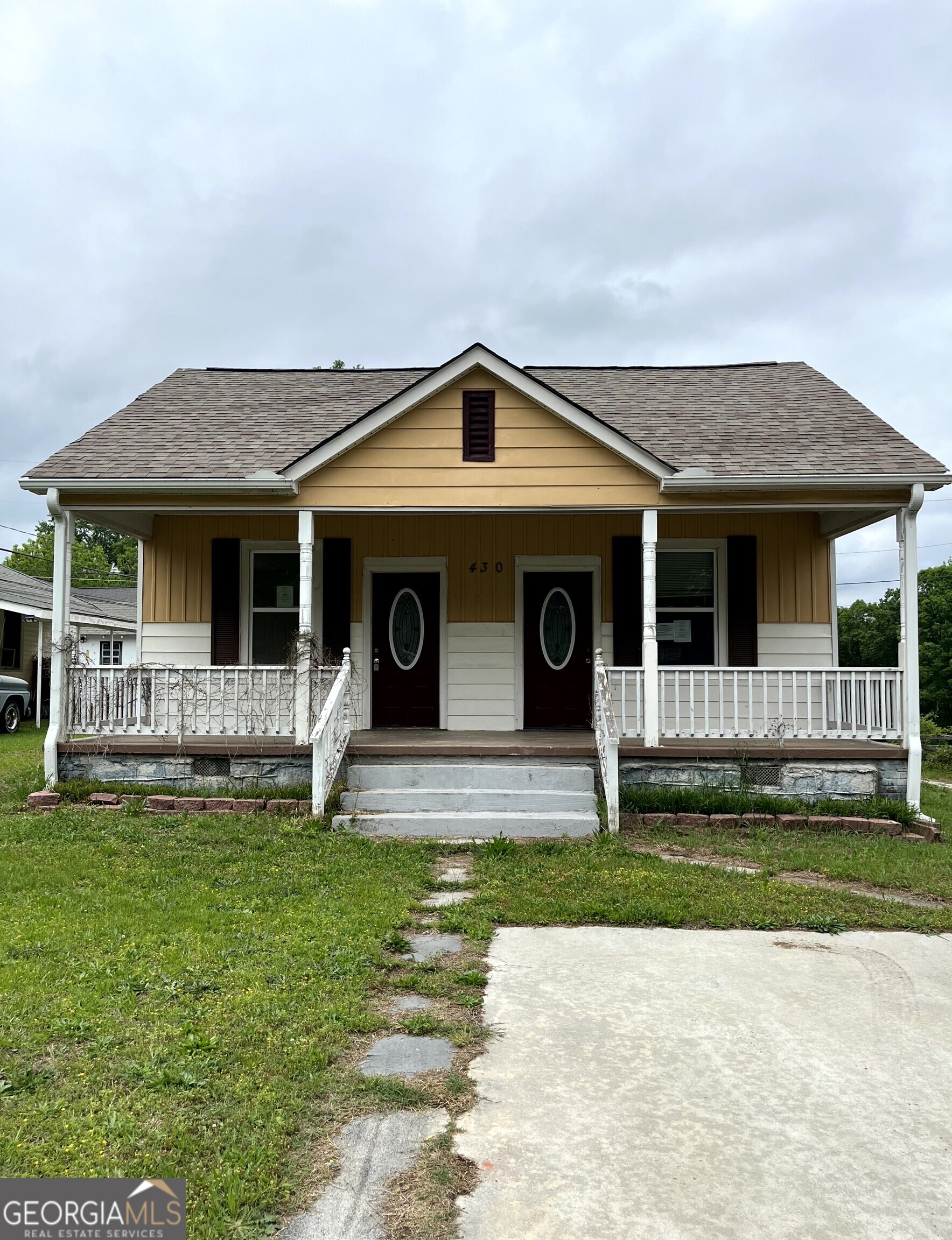 430 Knight Street Elberton, GA 30635 - Photo 2 of 15 a front view of a house with a yard