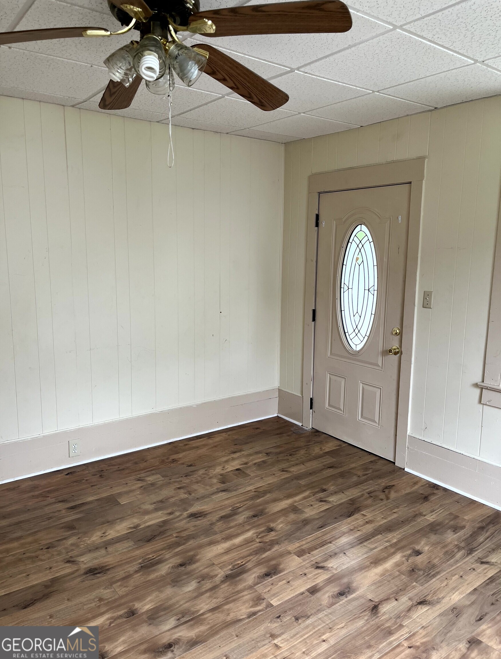 430 Knight Street Elberton, GA 30635 - Photo 5 of 15 a view of a room with wooden floor and white walls