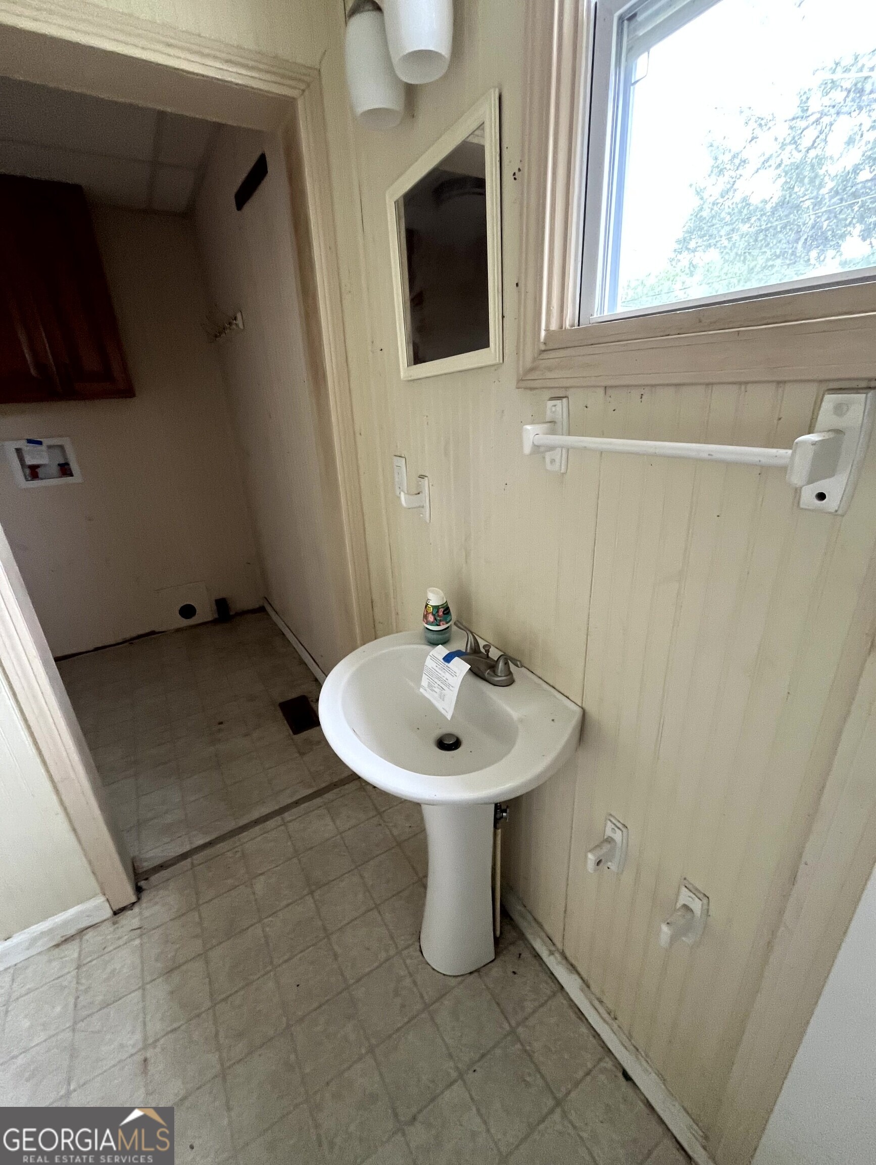 430 Knight Street Elberton, GA 30635 - Photo 10 of 15 a bathroom with a sink a toilet and a mirror