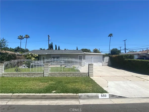 a view of a house next to a yard