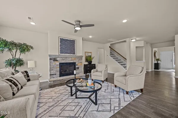 a living room with furniture and a fireplace