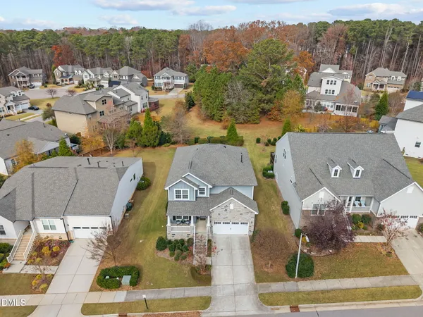 an aerial view of residential houses with outdoor space