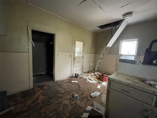 a bedroom with a bed and a mirror