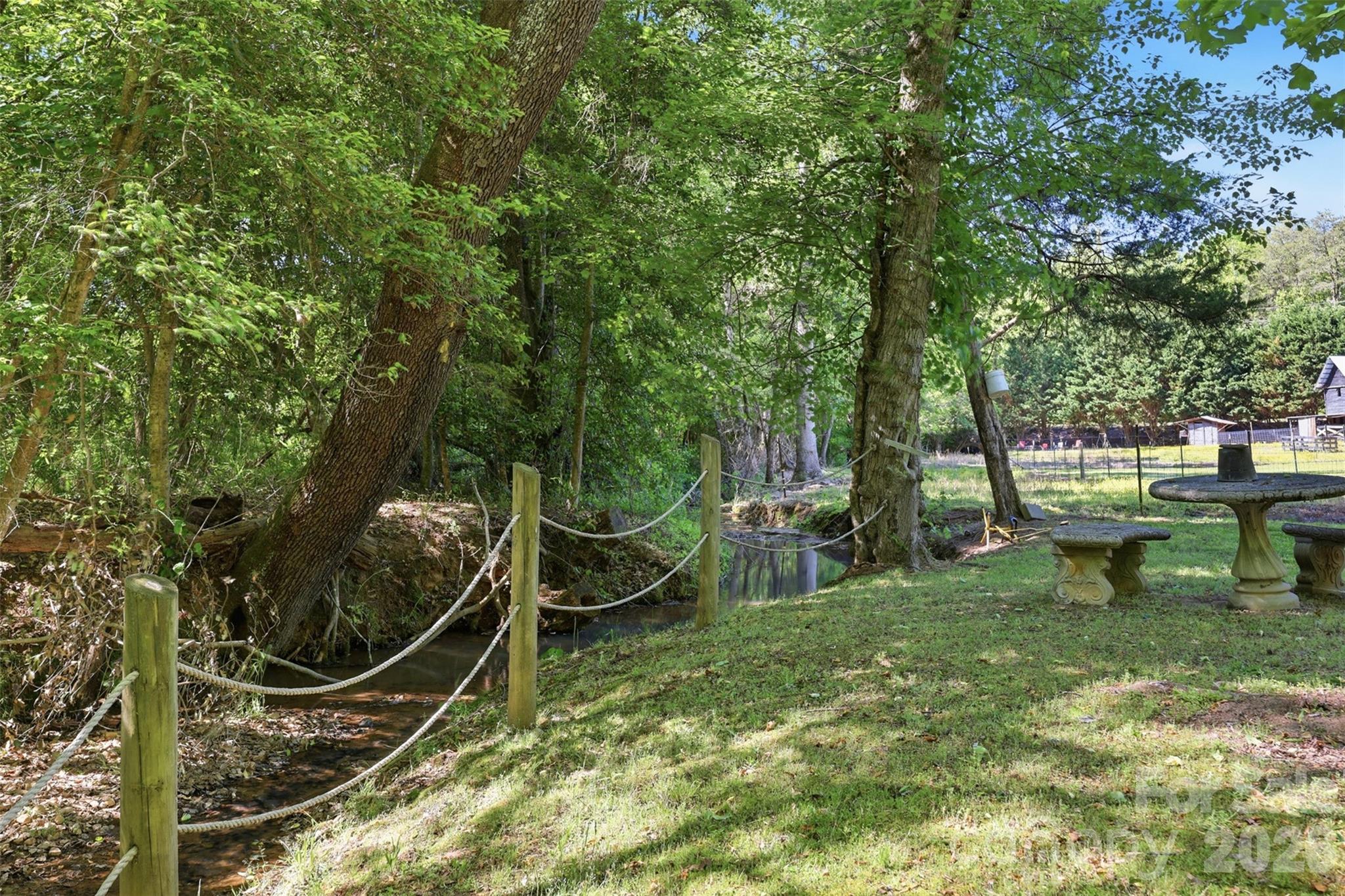 176-174 Oak Hollow Road Union Grove, NC 28689 - Photo 10 of 48 a view of an outdoor sitting area with golf course