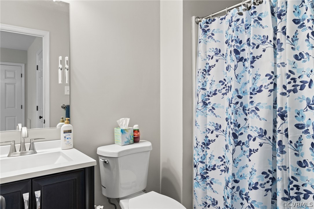 3551 Markey Road Midlothian, VA 23112 - Photo 17 of 24 a bathroom with a sink toilet and a mirror