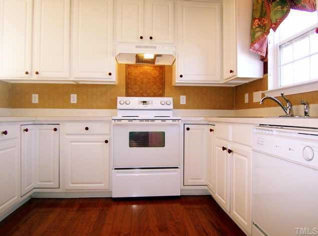 The large kitchen has real 3/4-inch hardwood floor, lots of beautiful cabinets and a door to the rear deck. Other
