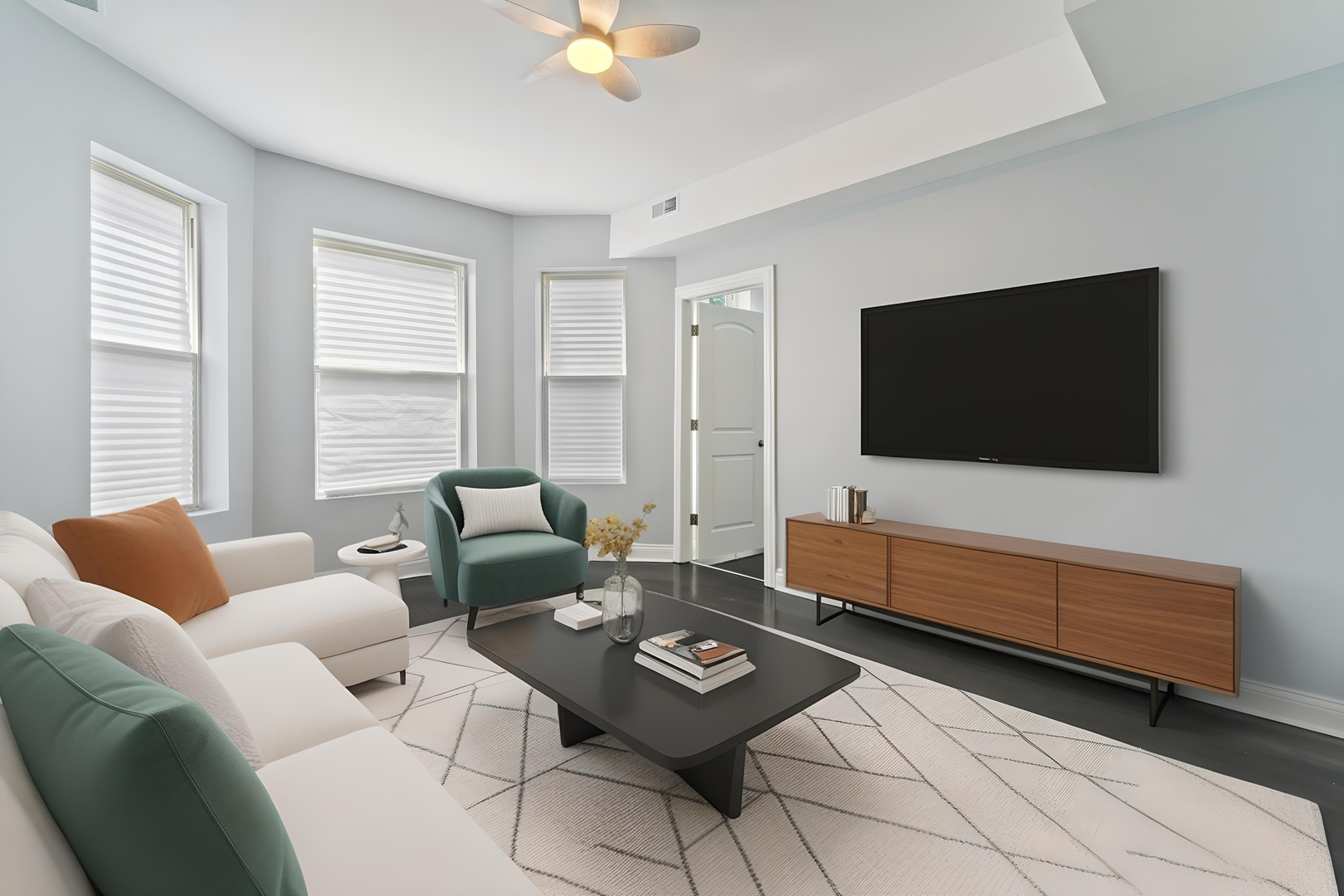 4718 West Monroe Street Chicago, IL 60644 - Photo 2 of 13 a living room with furniture and a flat screen tv