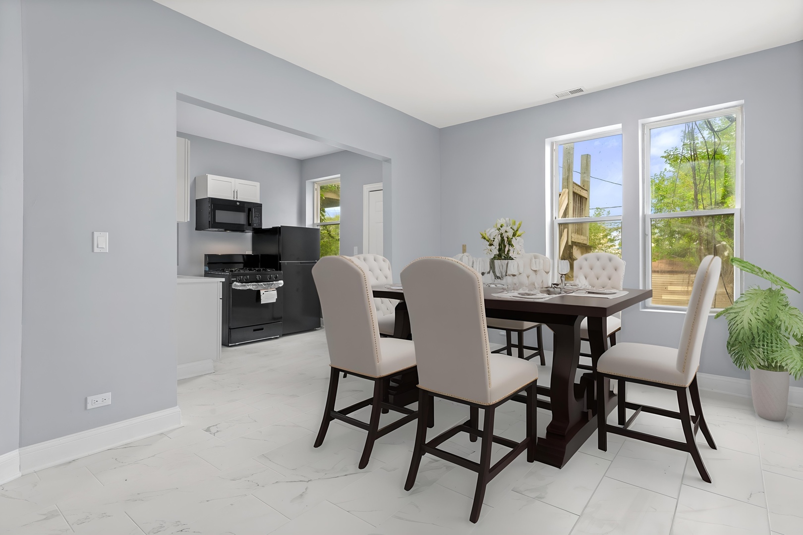 4718 West Monroe Street Chicago, IL 60644 - Photo 4 of 13 a view of a dining room with furniture window and outside view