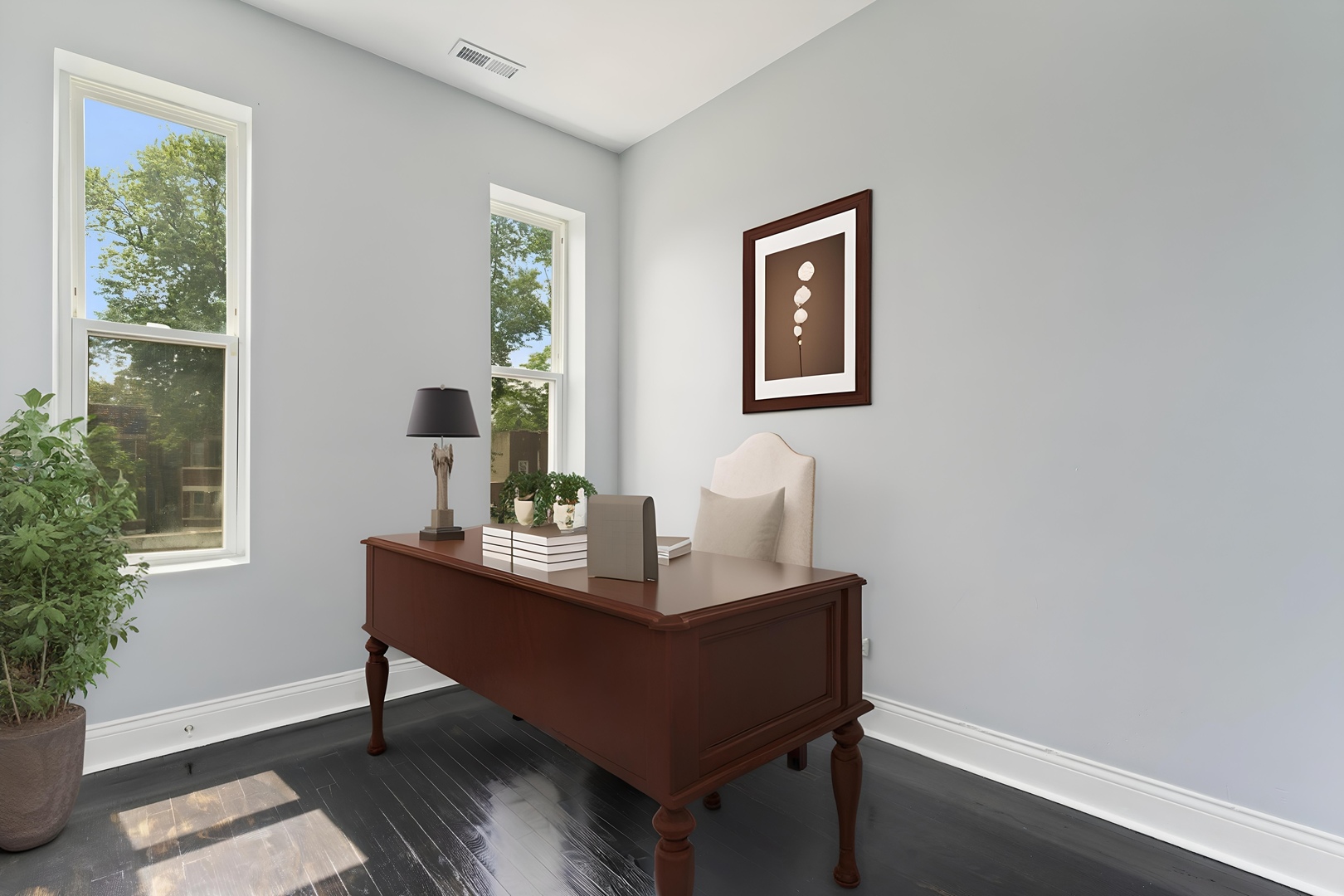 4718 West Monroe Street Chicago, IL 60644 - Photo 9 of 13 a view of a workspace with furniture and a potted plant