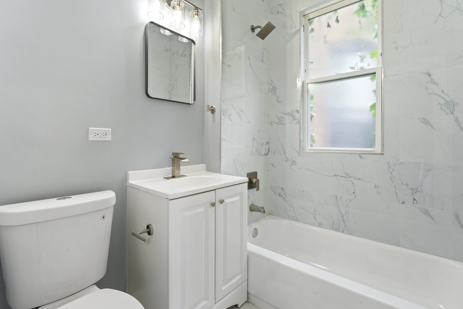 4718 West Monroe Street Chicago, IL 60644 - Photo 10 of 13 a bathroom with a sink toilet and shower