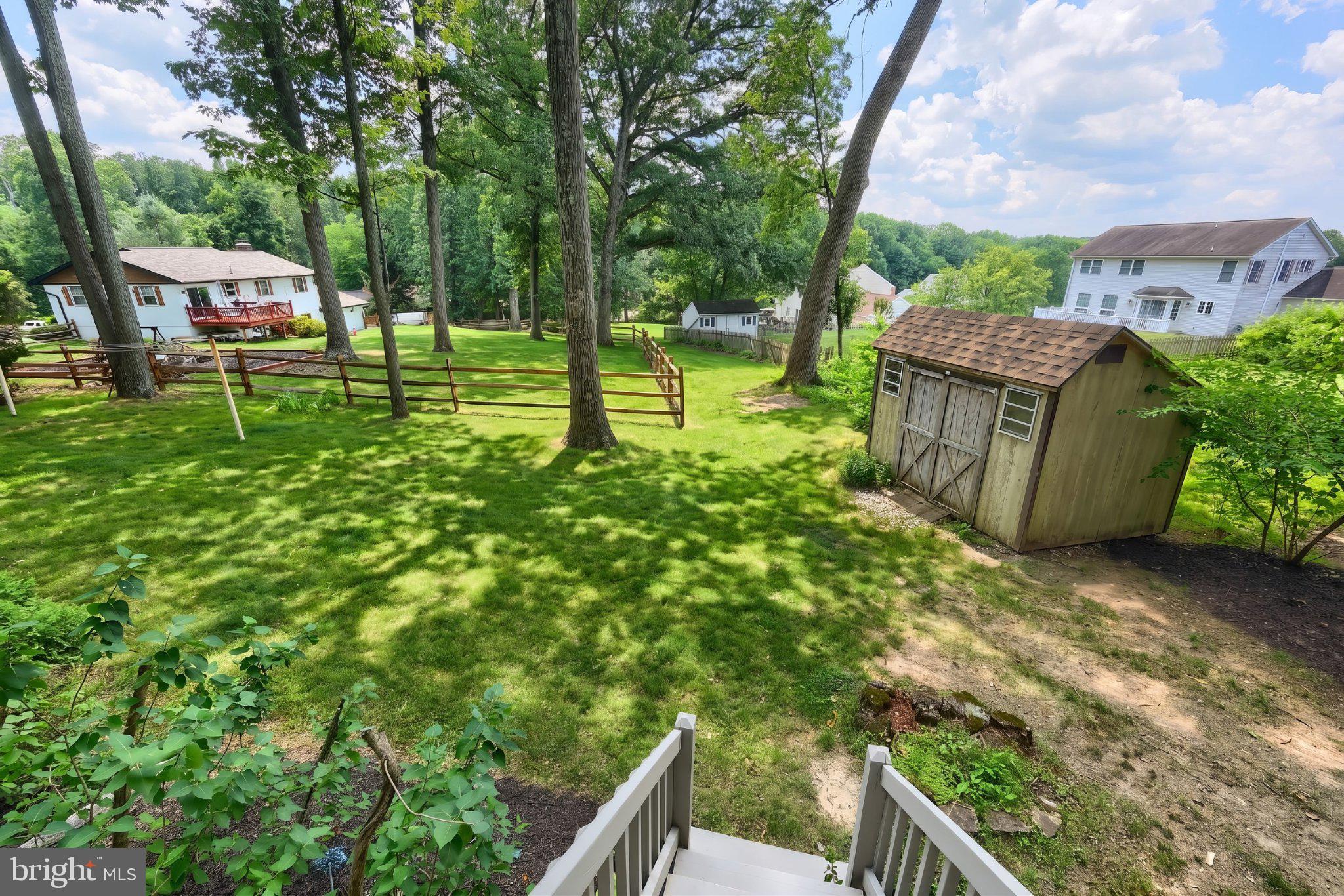468 Fairview Drive Hanover, PA 17331 - Photo 12 of 42 Serene backyard oasis with lush greenery.