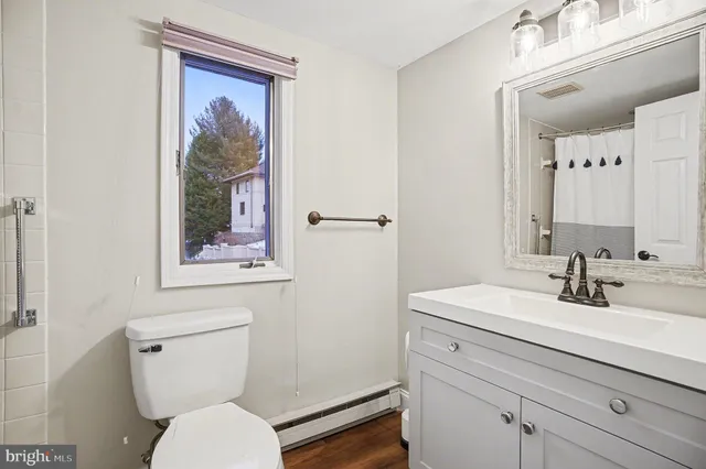 a bathroom with a bathtub a shower and a shower