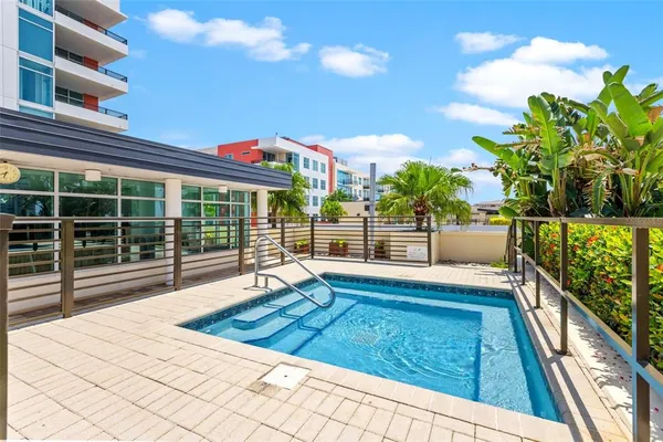 a view of a swimming pool with a patio