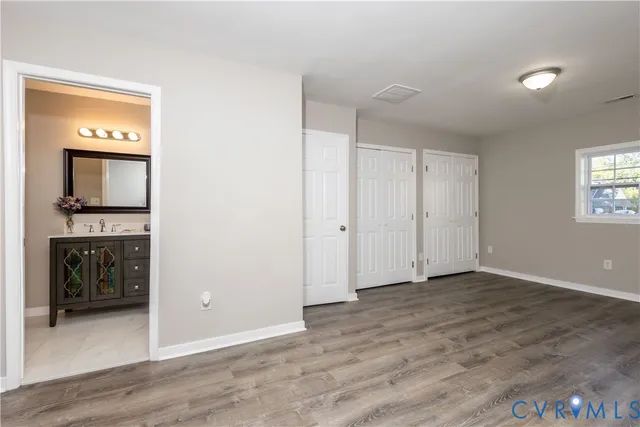 a view of an empty room and a fireplace