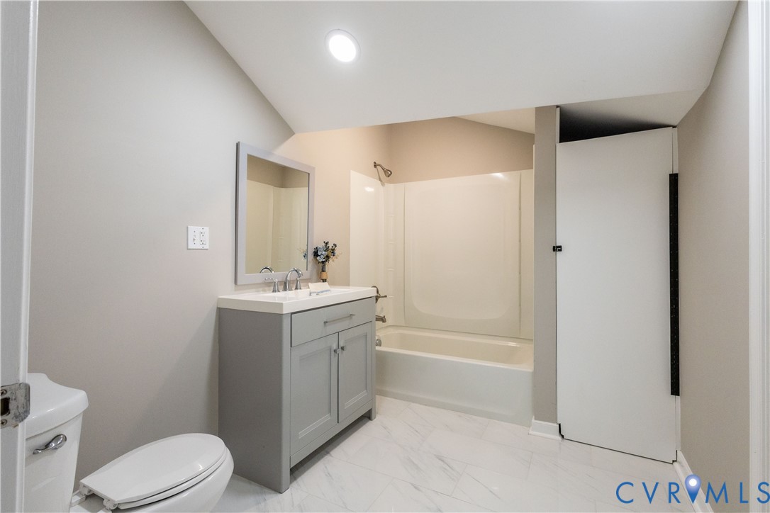 6103 Hermitage Road Henrico, VA 23228 - Photo 21 of 44 a bathroom with a sink a toilet and shower