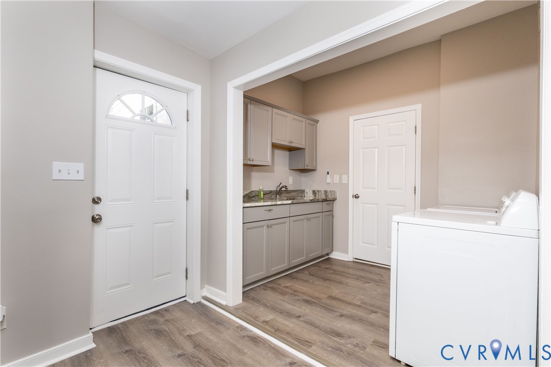 6103 Hermitage Road Henrico, VA 23228 - Photo 26 of 44 a kitchen with a refrigerator stove and sink