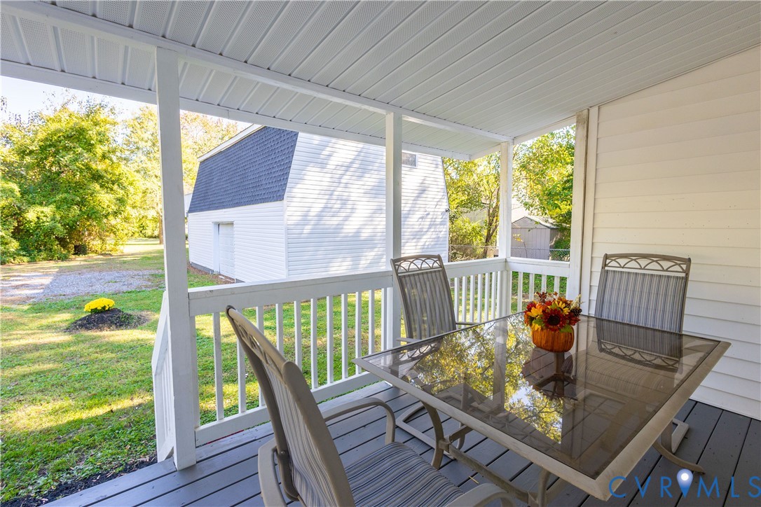 6103 Hermitage Road Henrico, VA 23228 - Photo 28 of 44 a view of a dining room with furniture window and wooden floor