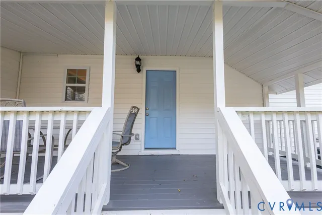 a view of entryway with wooden floor and stairs