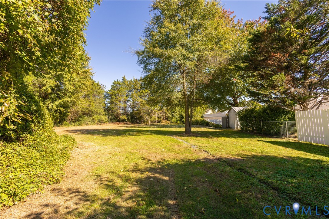 6103 Hermitage Road Henrico, VA 23228 - Photo 39 of 44 a view of yard with swimming pool and trees