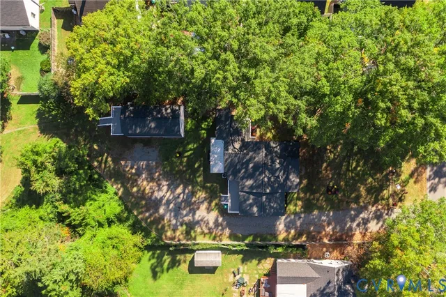 front view of a house with a tree