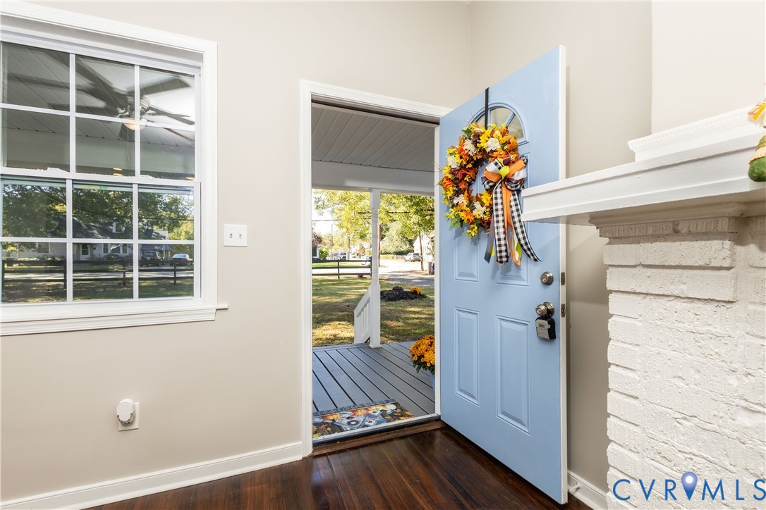 6103 Hermitage Road Henrico, VA 23228 - Photo 7 of 44 a view of a hallway with wooden floor and windows
