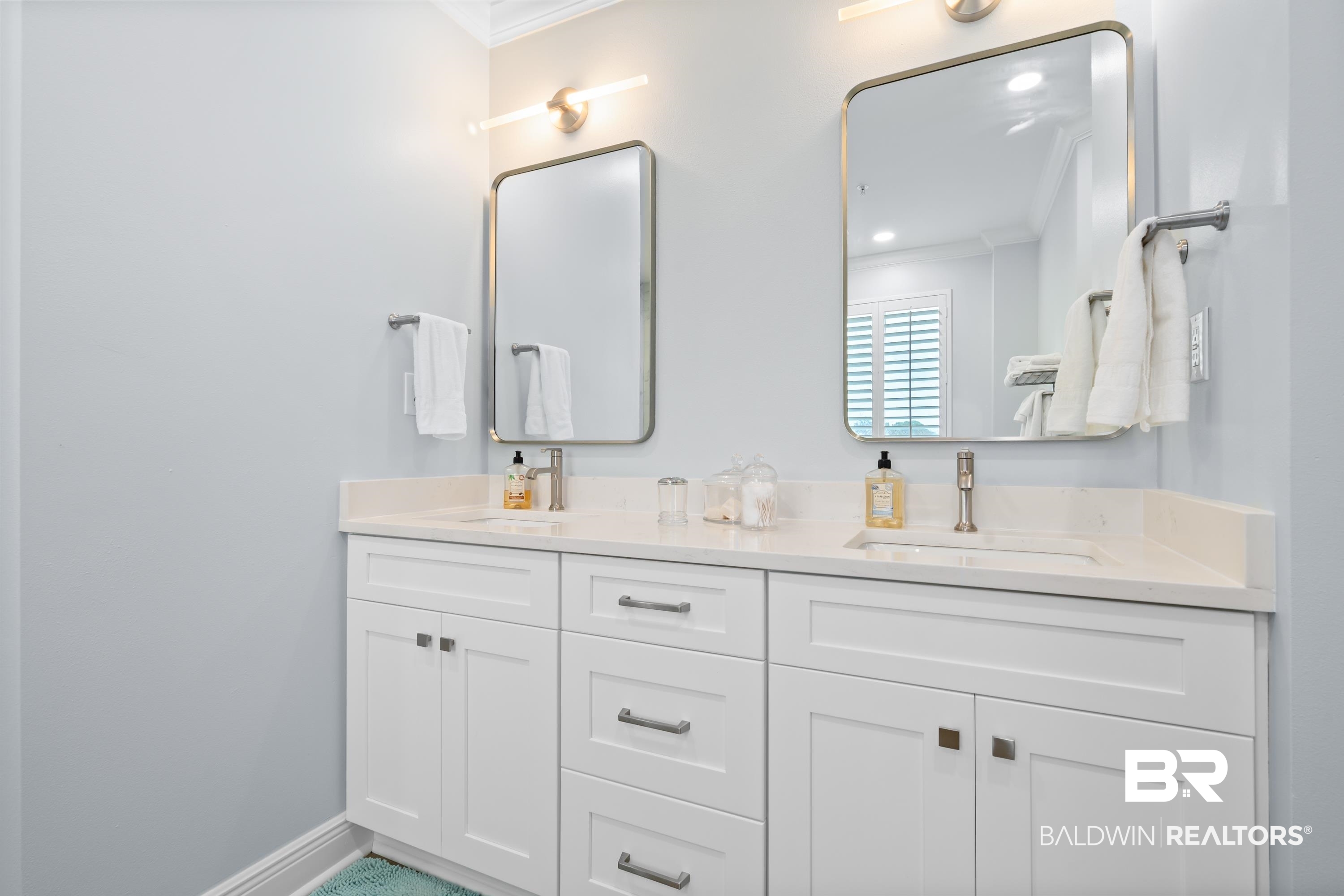 28250 Canal Road, Unit 101 Orange Beach, AL 36561 - Photo 11 of 34 Full bath with crown molding, baseboards, and a sink
