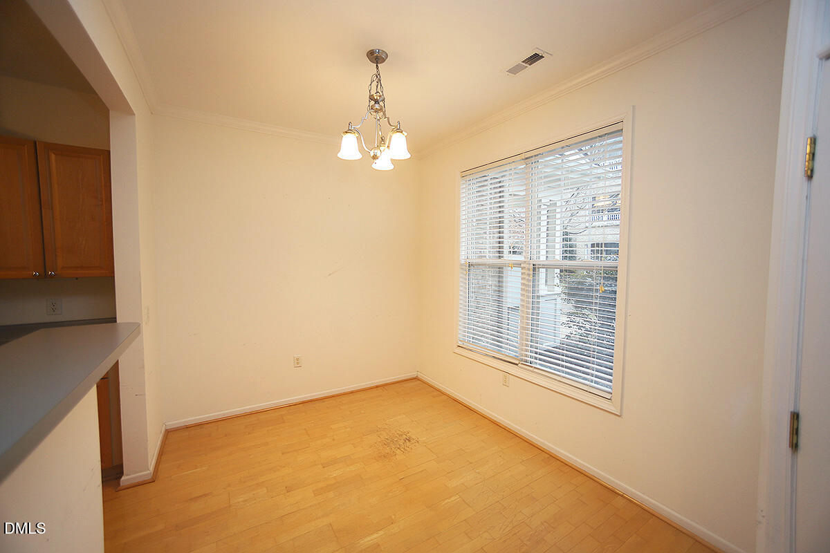 3161 Hemlock Forest Circle, Unit 101 Raleigh, NC 27612 - Photo 11 of 21 a view of an empty room with a window