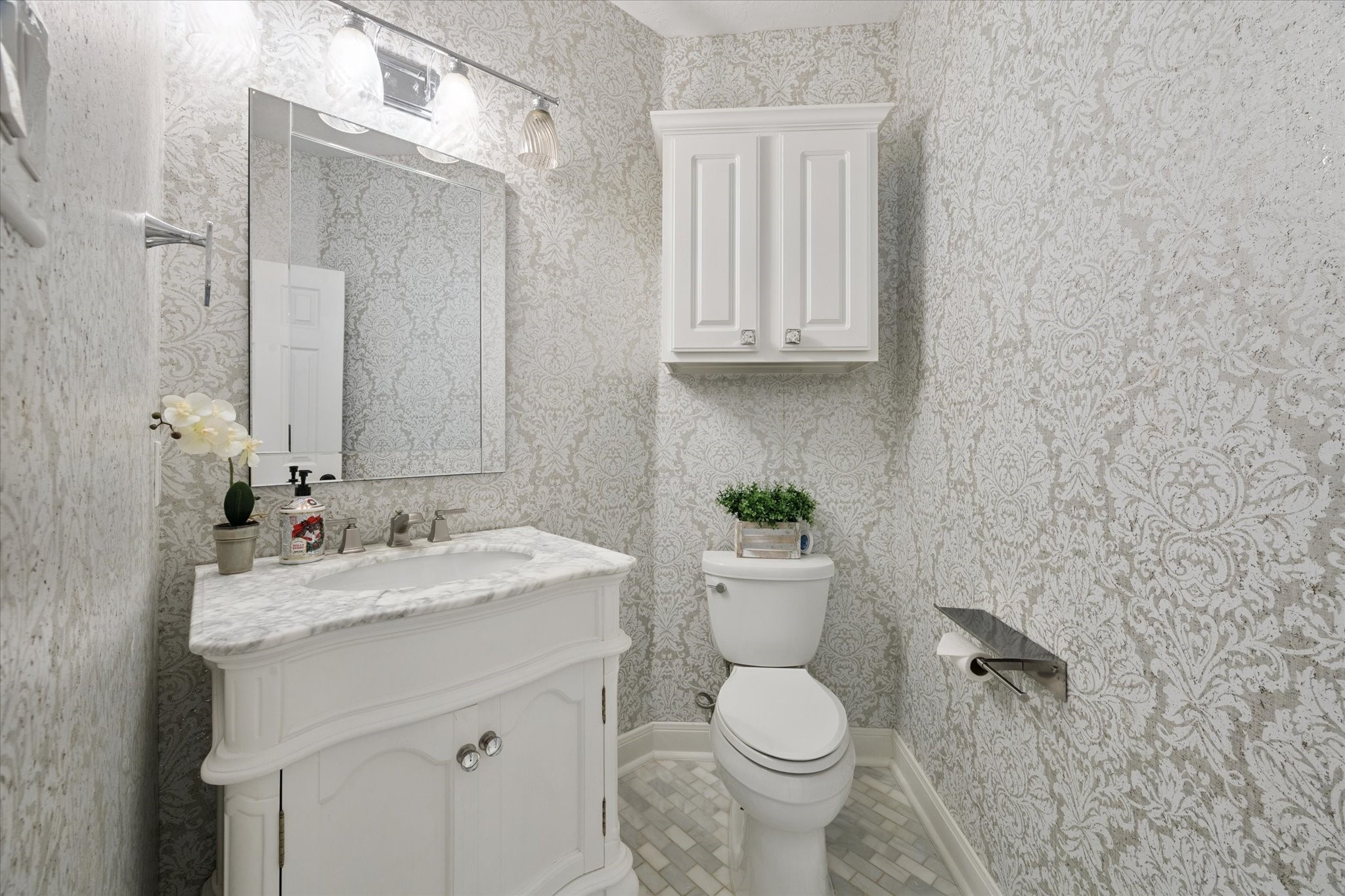 2904 Bridle Path Lane Friendswood, TX 77546 - Photo 29 of 49 One of two elegant half bathrooms in the home, this powder room is beautifully designed with stylish finishes, perfect for guests and everyday use.
