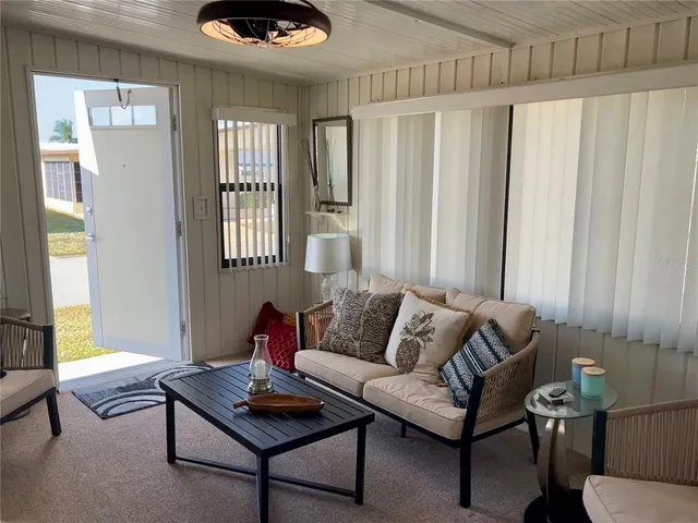 a living room with furniture and a window