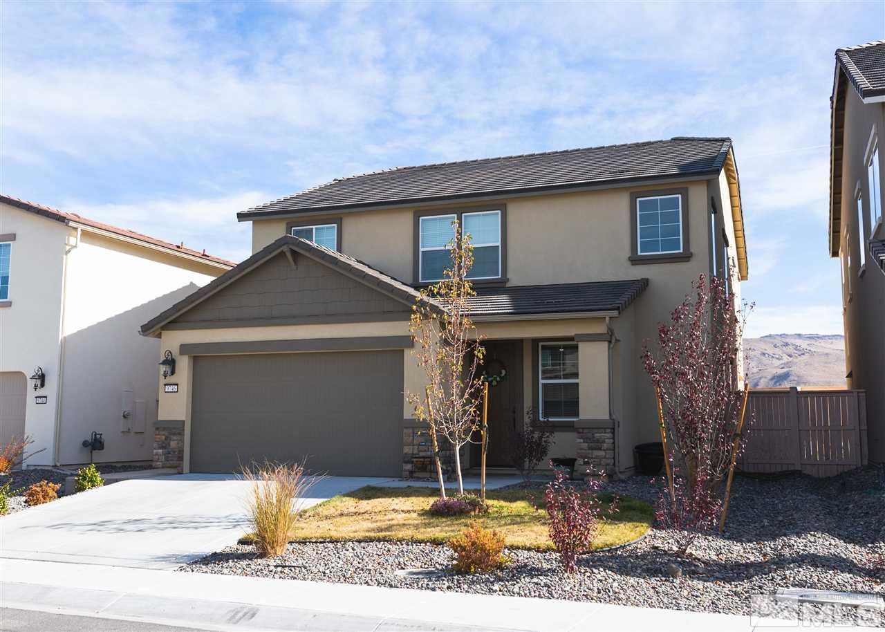 9746 Pachuca Drive Reno, NV 89521 - Photo 1 of 25 a front view of a house with garden