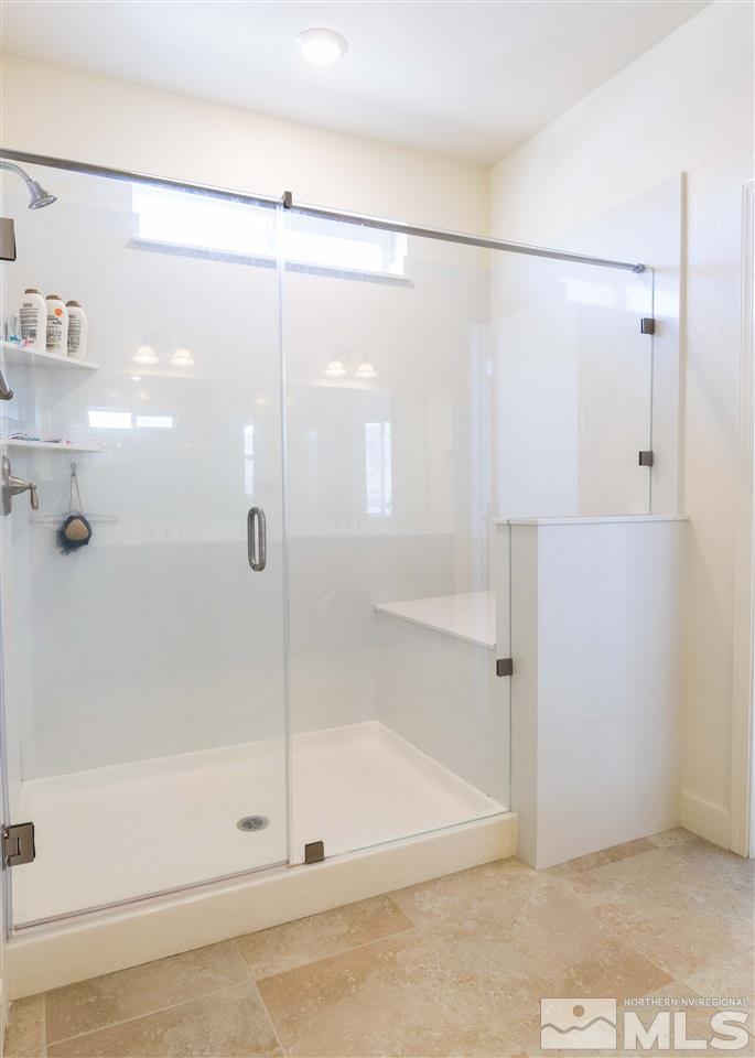 9746 Pachuca Drive Reno, NV 89521 - Photo 17 of 25 a bathroom that has a glass shower door