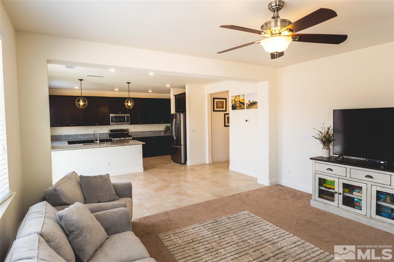 9746 Pachuca Drive Reno, NV 89521 - Photo 4 of 25 a living room with furniture and a flat screen tv