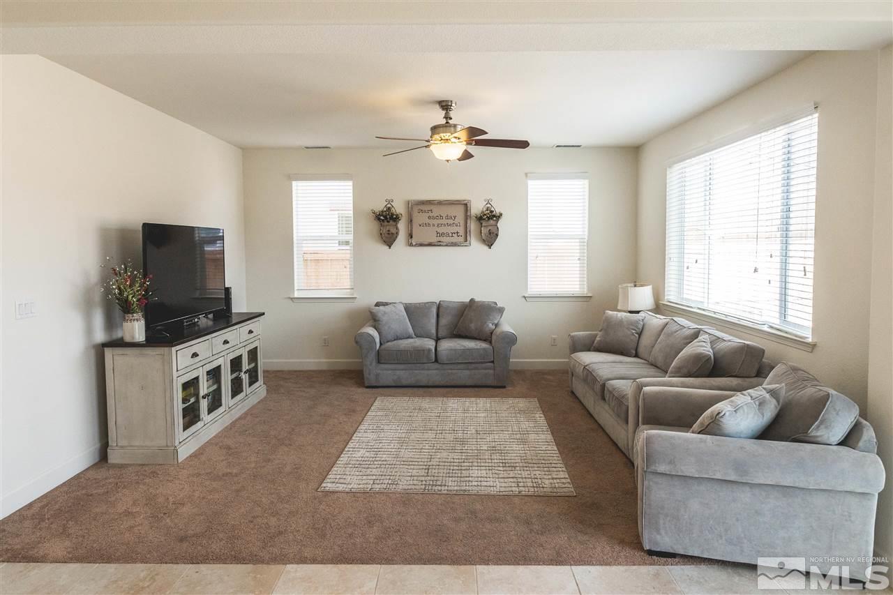 9746 Pachuca Drive Reno, NV 89521 - Photo 5 of 25 a living room with furniture and a flat screen tv