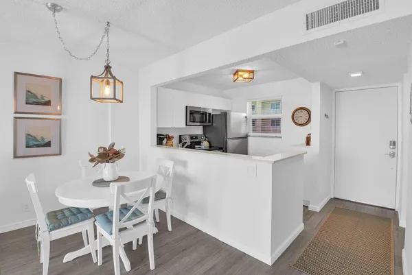 a dining room with furniture and window