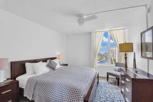 a bedroom with double bed and a night stand