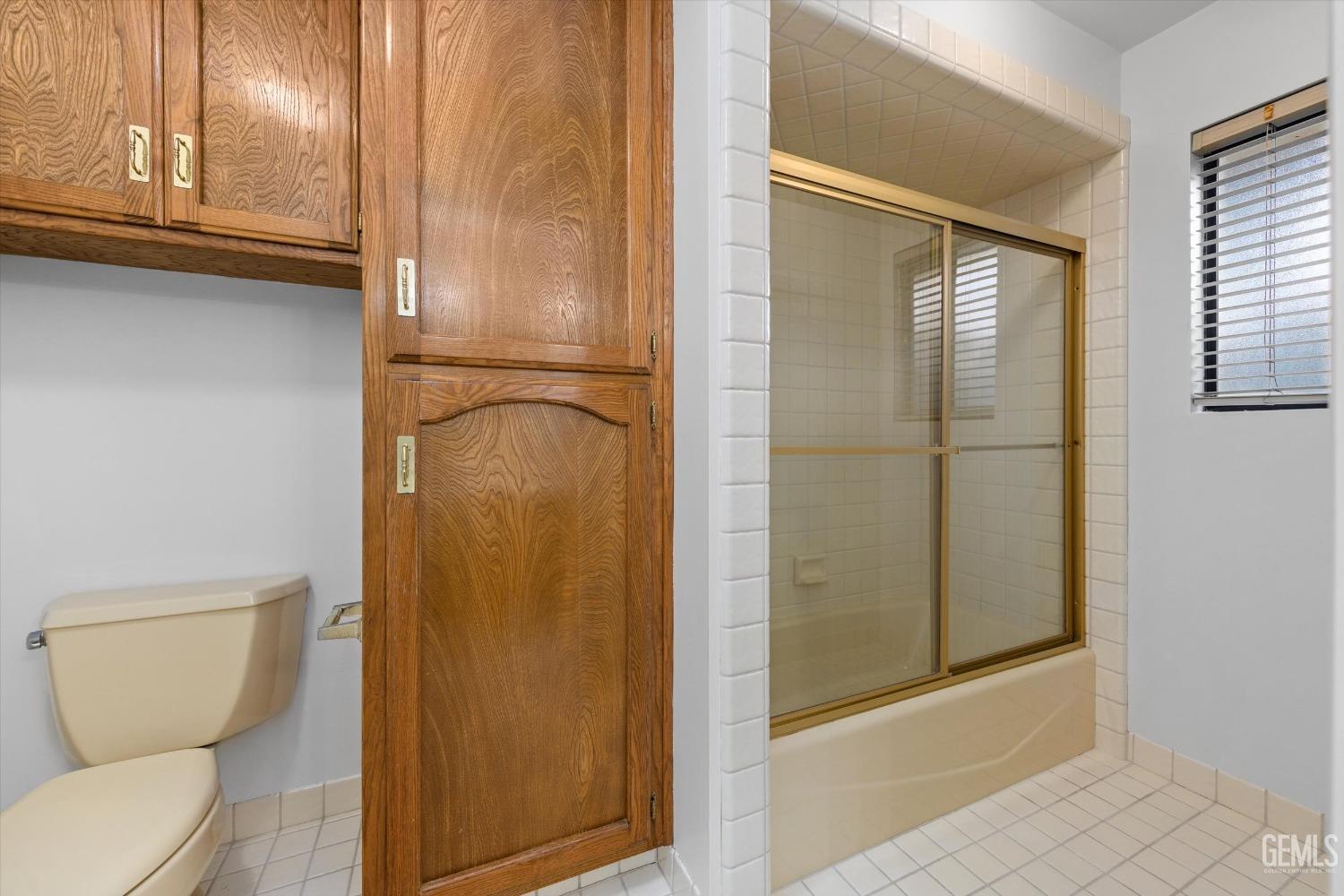 Undisclosed Address Bakersfield, CA 93312 - Photo 17 of 49 a bathroom with a toilet and a shower