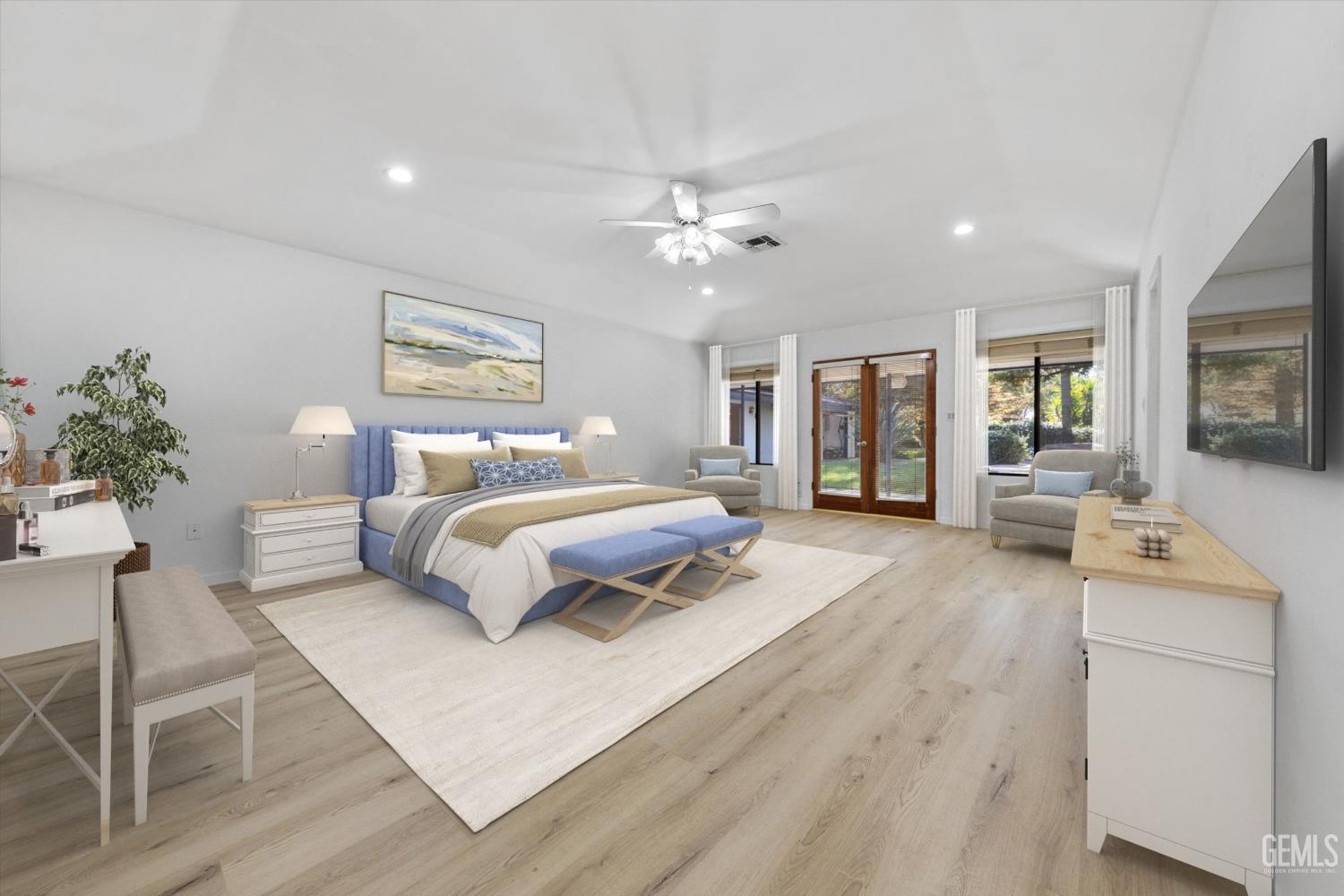 Undisclosed Address Bakersfield, CA 93312 - Photo 21 of 49 a bedroom with a large bed a chandelier and dresser