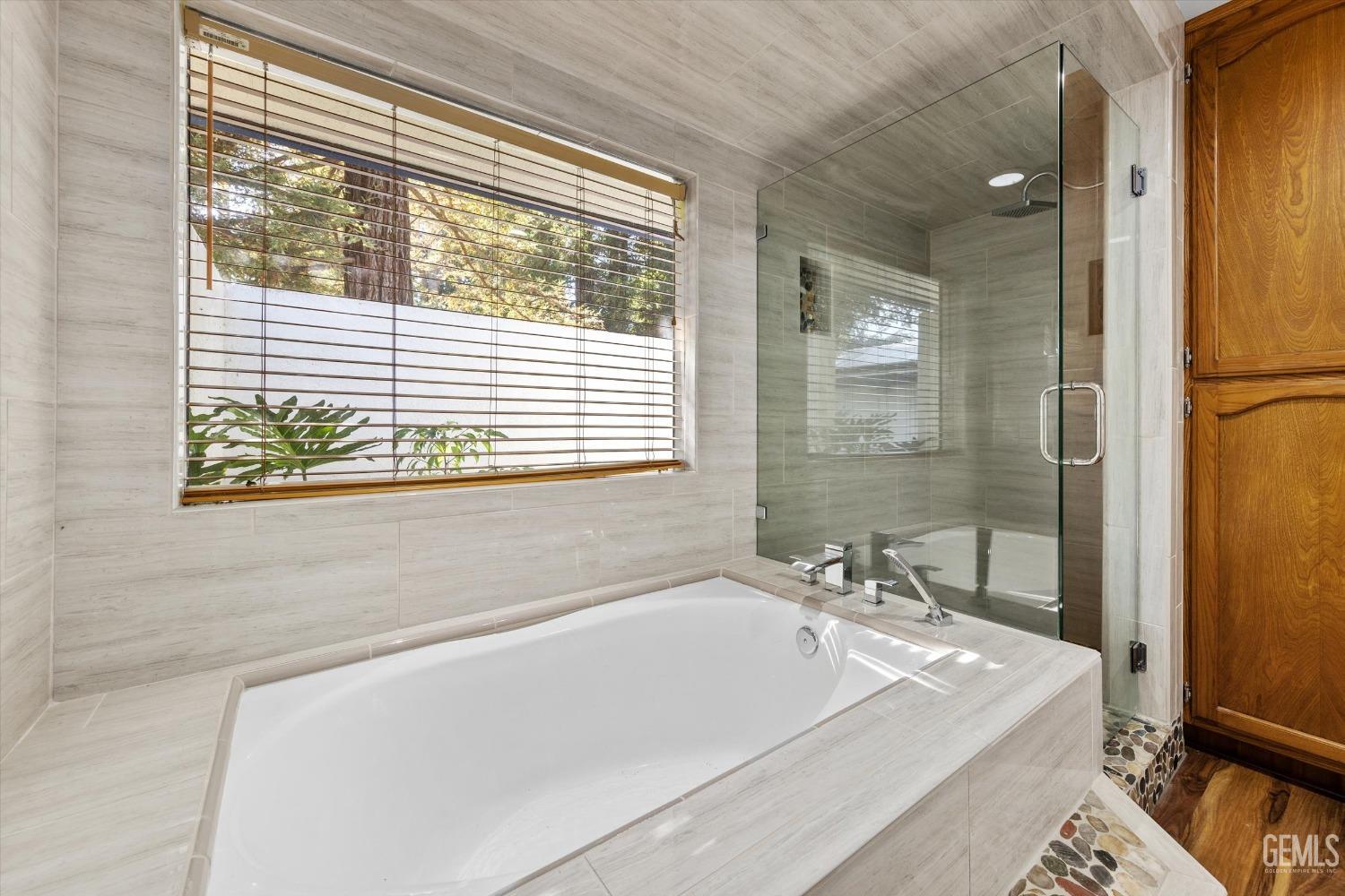 Undisclosed Address Bakersfield, CA 93312 - Photo 24 of 49 a bath tub sitting in a bathroom next to a window