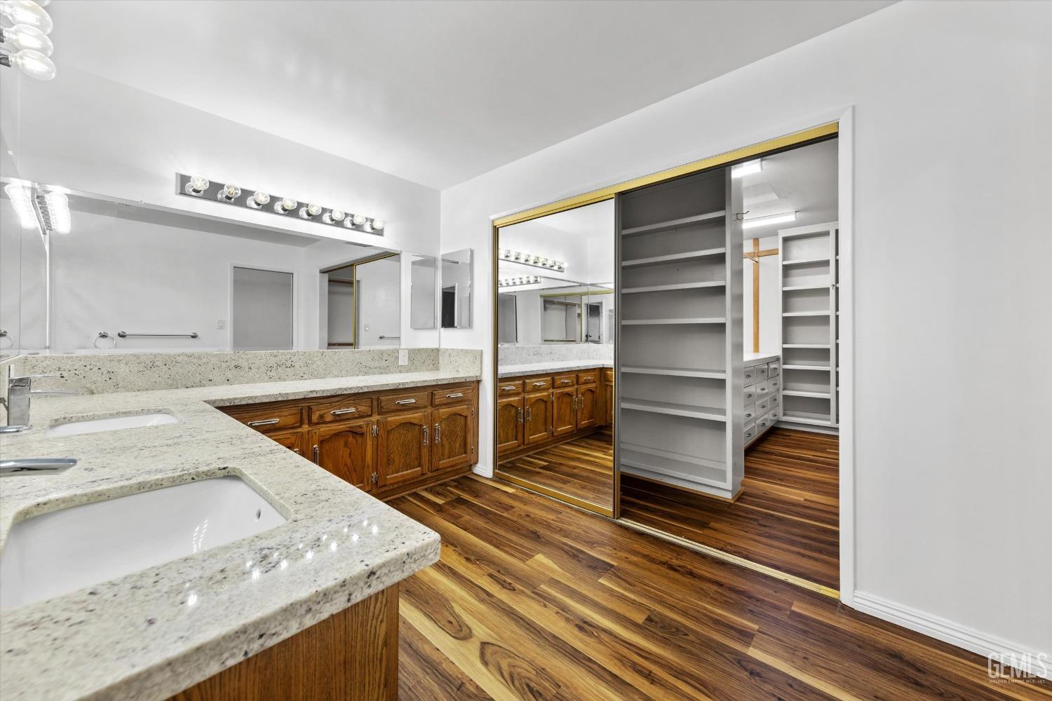 Undisclosed Address Bakersfield, CA 93312 - Photo 25 of 49 a kitchen with a sink and cabinets