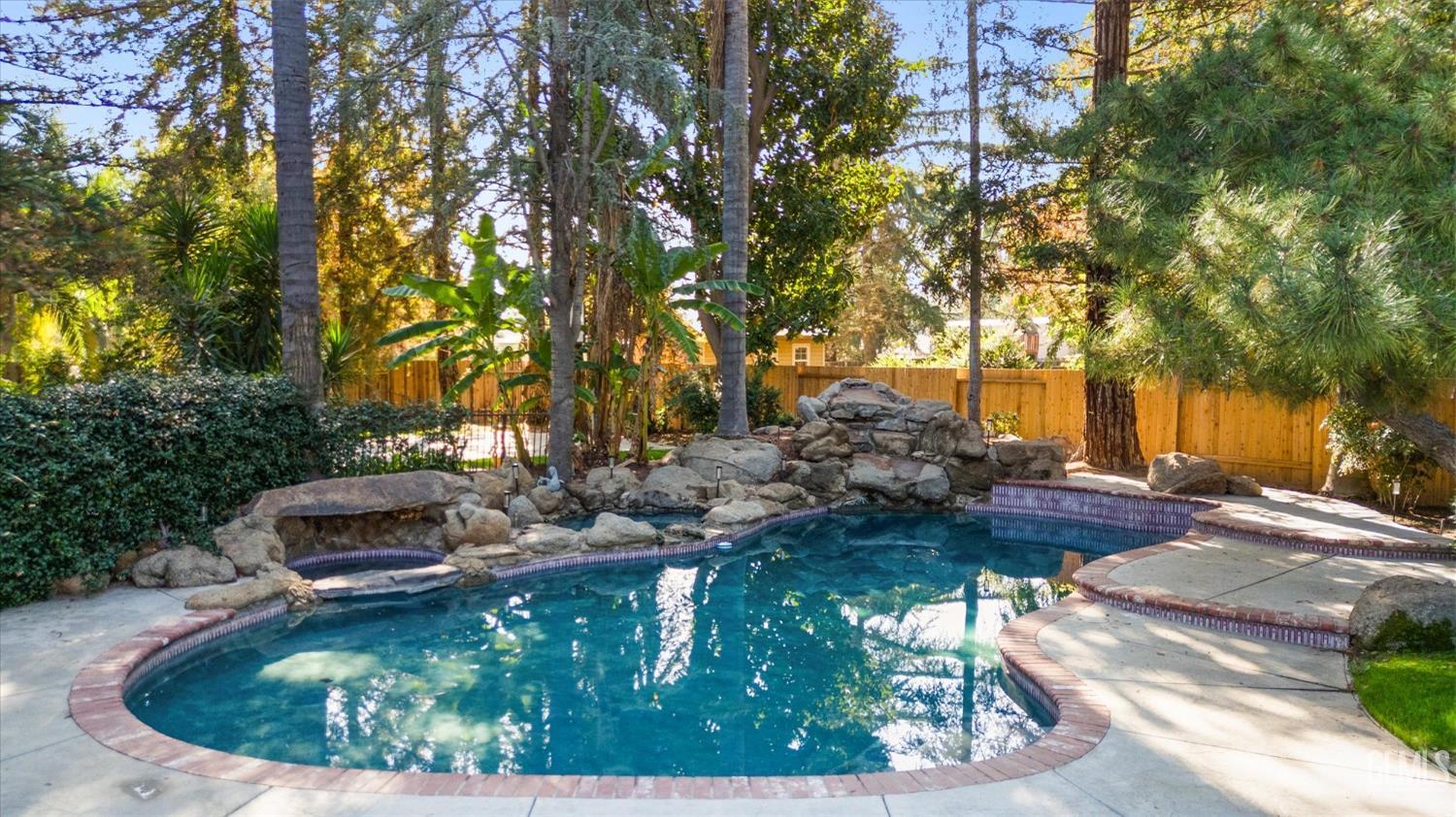 Undisclosed Address Bakersfield, CA 93312 - Photo 33 of 49 a view of a backyard with table and chairs