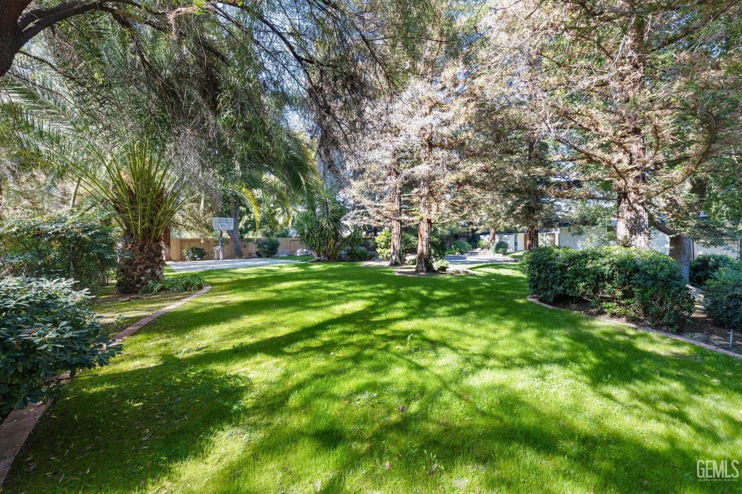 Undisclosed Address Bakersfield, CA 93312 - Photo 38 of 49 a view of green field with trees