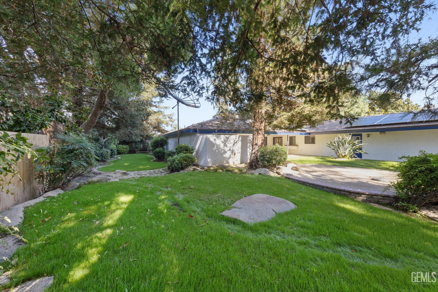 Undisclosed Address Bakersfield, CA 93312 - Photo 39 of 49 a view of a backyard with large trees