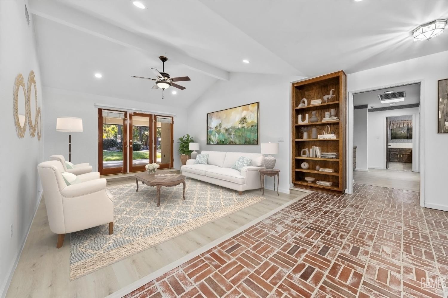 Undisclosed Address Bakersfield, CA 93312 - Photo 4 of 49 a living room with furniture and a floor to ceiling window