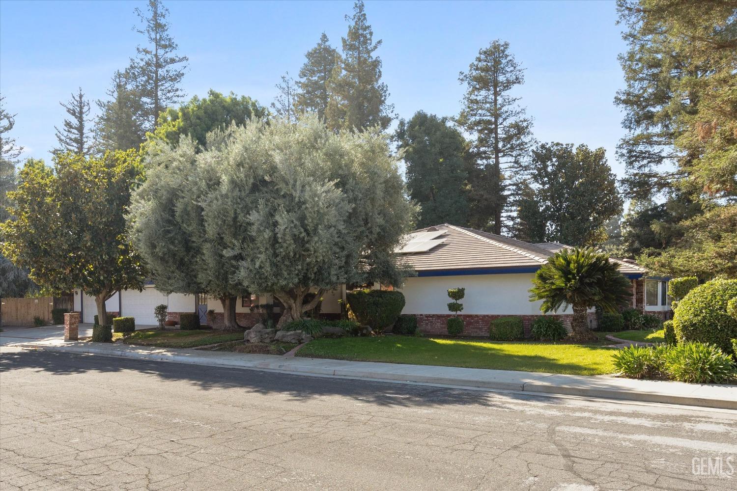 Undisclosed Address Bakersfield, CA 93312 - Photo 41 of 49 a view of a swimming pool and trees in the background