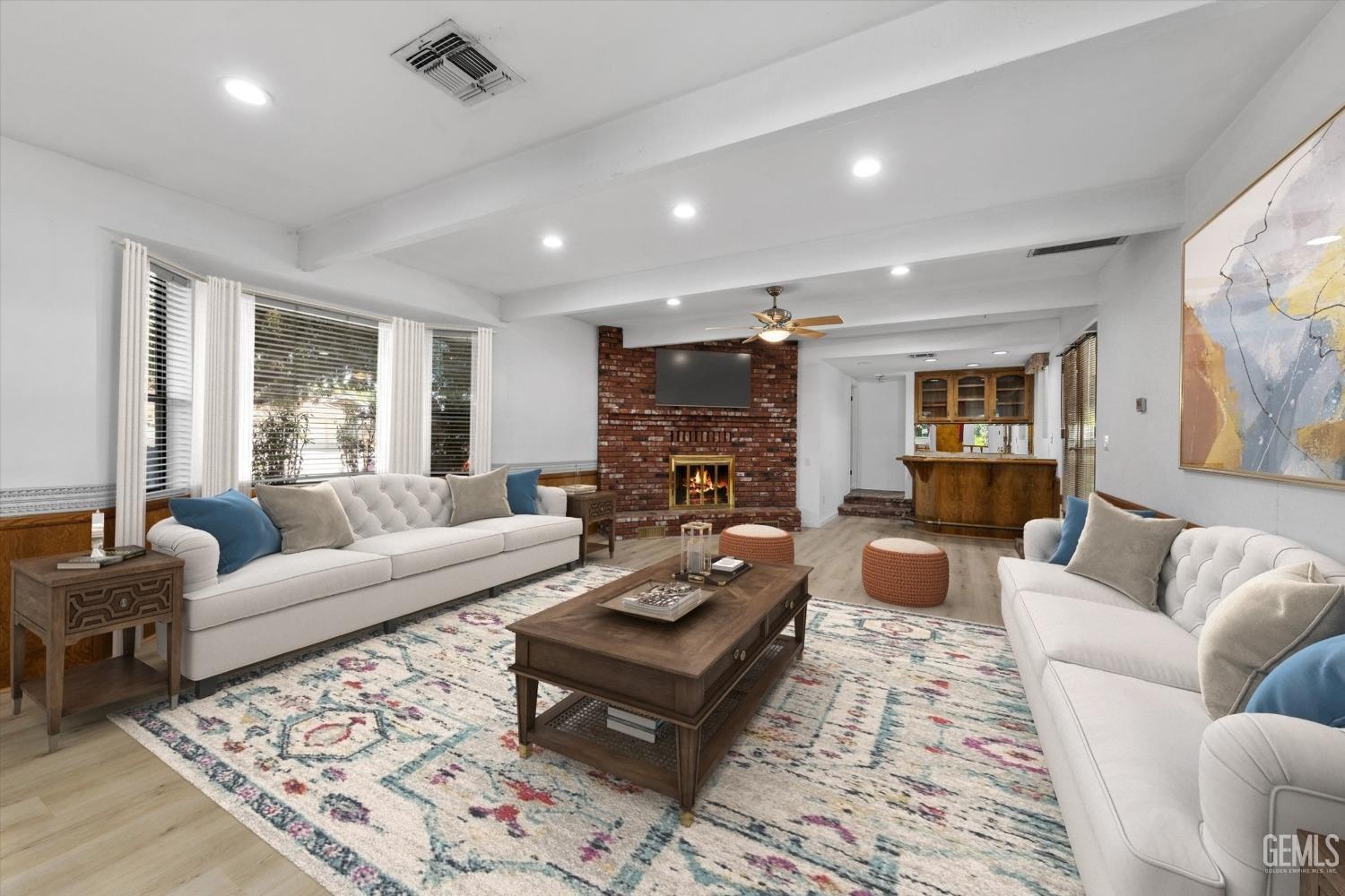 Undisclosed Address Bakersfield, CA 93312 - Photo 7 of 49 a living room with furniture fireplace and a large window